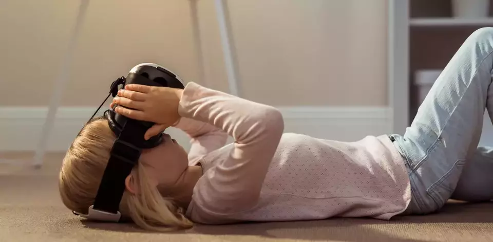 Little girl wearing VR headset